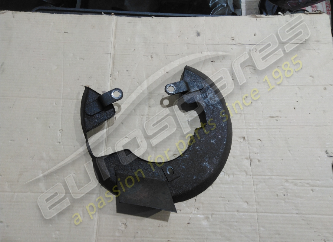 PROTECTION DE DISQUE DE FREIN GAUCHE Ferrari UTILISÉ. NUMÉRO DE PIÈCE 104597 (1)